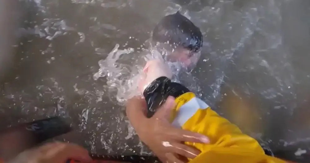 Dramatic bodycam shows rescue of two boys seconds from drowning
